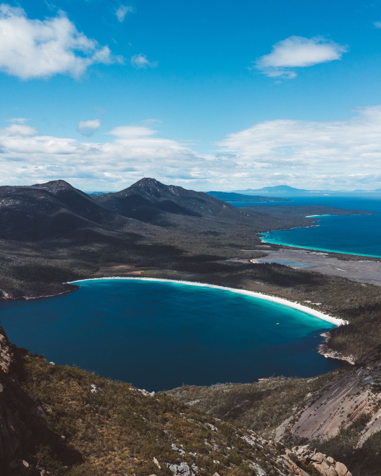 Wineglass Bay curving below granite peaks